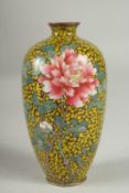 A JAPANESE YELLOW GROUND GLITTERED ENAMEL CLOISONNE VASE, decorated with a flower, with character