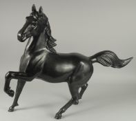 A LARGE JAPANESE TAISHO / SHOWA SIGNED BRONZE HORSE, in a cantering pose, engraved signature to