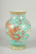 A 19TH CENTURY CHINESE TURQUOISE GROUND FAMILLE ROSE PORCELAIN DRAGON VASE, the body enamel
