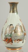 A JAPANESE KUTANI PORCELAIN BOTTLE VASE, painted with figures with fine gilt highlights, the base