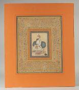 A LARGE INDIAN MINIATURE PAINTING, depicting a seated figure, a huqqa pipe beside him, with fine