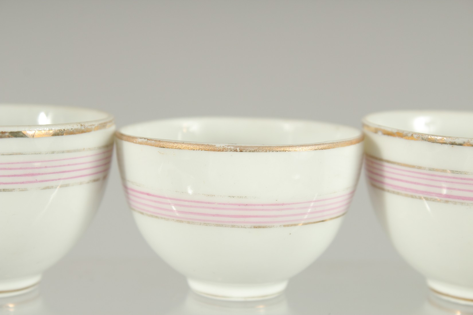 FOUR RUSSIAN PORCELAIN CUPS MADE FOR THE QAJAR MARKET (4). 5.5cm diameter. - Image 4 of 6