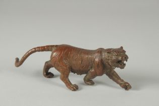 A JAPANESE BRONZE OKIMONO OF A TIGER.