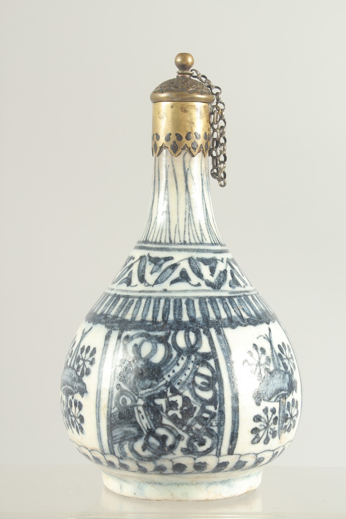 AN ISLAMIC BLUE AND WHITE PORCELAIN BOTTLE VASE, for the Chinese market, 19cm high.