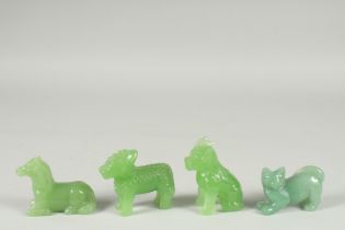 FOUR CHINESE GREEN GLASS ANIMAL FIGURES, (4).