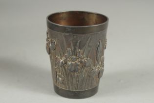 A CHINESE METAL BEAKER, relief decorated with flora, 6cm high.