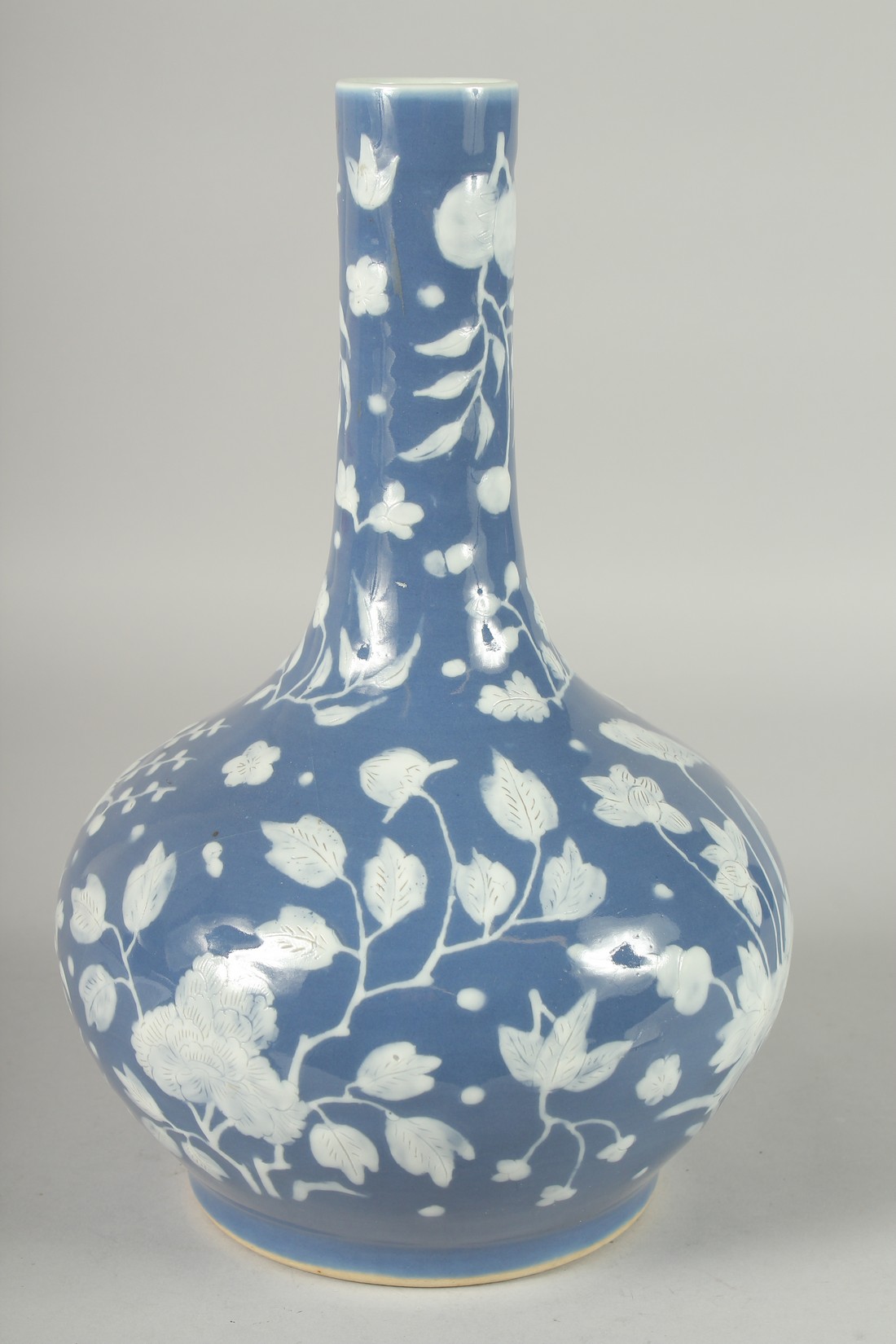 A CHINESE BLUE GROUND PORCELAIN VASE, with carved floral decoration in white, 34cm high. - Image 2 of 5