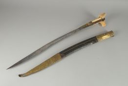 A FINE 19TH CENTURY OTTOMAN TURKISH YATAGHAN SWORD with coral inset walrus handle and silver