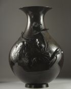 A LARGE JAPANESE MEIJI PERIOD BRONZE VASE, with relief decoration depicting an egret and frog