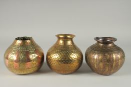 A COLLECTION OF THREE SOUTH INDIAN MIXED METAL LOTA VESSELS, each approximately 14cm high, (3).