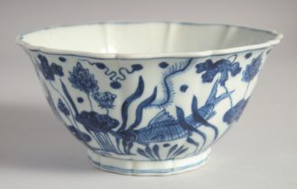 A CHINESE BLUE AND WHITE PORCELAIN PETAL FORM BOWL, painted with fish and aquatic flora, six-