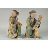 A LARGE PAIR OF 19TH CENTURY CHINESE SANCAI GLAZED POTTERY FIGURES, 33cm high.