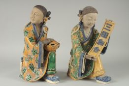 A LARGE PAIR OF 19TH CENTURY CHINESE SANCAI GLAZED POTTERY FIGURES, 33cm high.