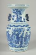 A 19TH CENTURY CHINESE BLUE AND WHITE PORCELAIN TWIN HANDLE VASE, the body painted with immortals,