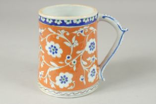 AN OTTOMAN TURKISH POTTERY TANKARD, 15cm high.