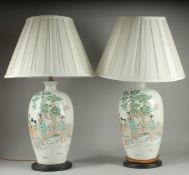 A PAIR OF CHINESE FAMILLE VERTE PORCELAIN VASE LAMPS, painted with female figures beside a tree,