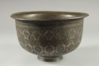 A 16TH-17TH CENTURY SIGNED SAFAVID TINNED COPPER BOWL, engraved with decorative floral motifs, 25.