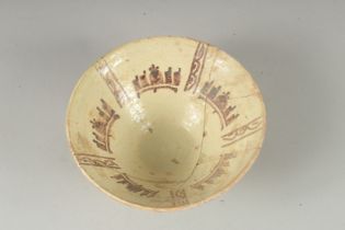 A NISHAPUR GLAZED POTTERY BOWL, 19.5cm diameter.