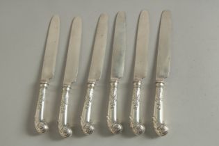 A SET OF SIX GEORGE II SILVER PISTOL HANDLE CHEESE KNIVES. London 1752-1760.