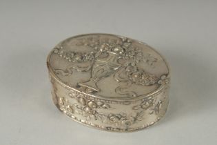 A DUTCH OVAL SILVER PILL BOX urns and garland decoration. 6cm .