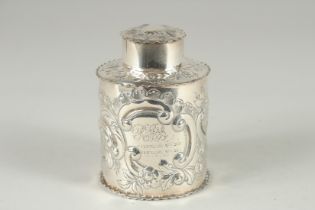 A SILVER TEA CANNISTER, circular with floral embossed decoration. Birmingham, 1893. 4.25ins high.