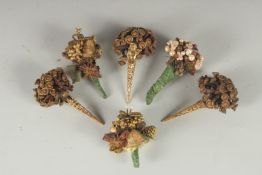 A COLLECTION OF SIX POSY HOLDERS.