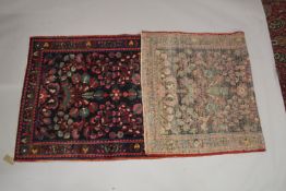 A PERSIAN WOOL RUNNER OR HALL CARPET dark blue ground with large floral design. 9ft 11ins x 3ft