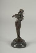 A SMALL BRONZE OF A GIRL PLAYING A VIOLIN on a circular base.