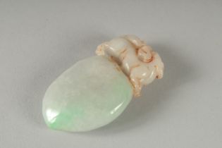 A CARVED JADE PENDANT with dog of foe top. 2.25ins.