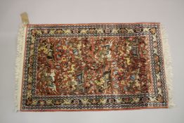 A SMALL PART SILK PERSIAN HUNTING RUG rust ground decorated with huntsmen on horseback. 3ft 3ins x