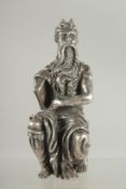 A SILVERED SEATED FIGURE OF MOSES. 6ins high.