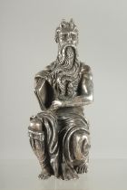 A SILVERED SEATED FIGURE OF MOSES. 6ins high.