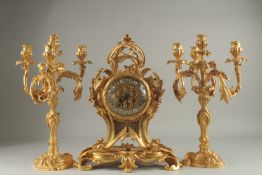 A GOOD LOUIS XVITH STYLE ORMOLU CLOCK GARNITURE the clock with Roman numerals and acanthus