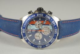 A GENTLEMAN'S TAG HEUER MULTI COLOUR DIAL WRITST WATCH with blue leather strap. No. CAZIOIN - WAY