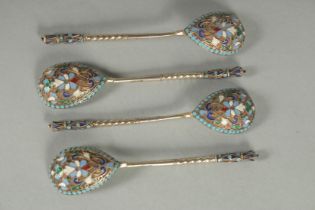 A SET OF FOUR RUSSIAN SILVER AND ENAMEL SPOONS. 10.5cm long. Marks: Head, 84. Weight: 42gms.