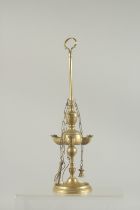 A BRASS STANDING OIL LAMP. 12ins high.