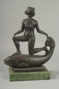 AN ART DECO BRONZE, A GIRL ON A FISH with metal base. 13ins high.