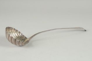 A GEORGE III SILVER LADLE with shell shaped bowl, marks indistinct. 13ins long.