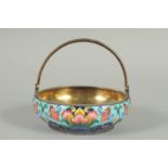 A RUSSIAN CIRCULAR SILVER AND ENAMEL SUGAR BASKET with swivel handles. 10.5cm diameter, 3.5cm