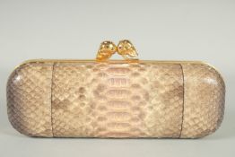 ALEXANDER MCQUEEN A SNAKE SKIN CLUTCH BAG with skull clasp. 9ins long.