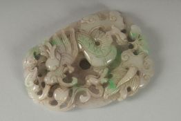 A LARGE CHINESE CARVED AND PIERCED JADE of a dragon. 9cm x 7cm.