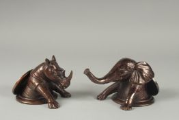 A PAIR OF DESK WEIGHTS, ELEPHANT AND RHINO. 4ins.