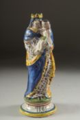 A FAIENCE MADONNA AND CHILD. 9ins high.