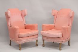 A PAIR OF PINK WING ARM CHAIRS on cabriole legs.