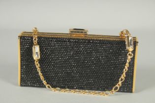 A JUDITH LEIBER OF NEW YORK BLACK AND GREY BEADED EVENING BAG. 6ins long, 2.5ins high, 1.25ins