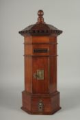 A GOOD REPLICA GEORGIAN STYLE MAHOGANY OCTAGONAL POST BOX, with carved top, letter box, door,