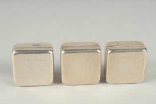 A SET OF THREE SILVER SQUARE SHAPED PILL BOXES, each engraved with initials K A P. Stamped 925, 1.