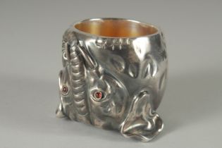 A RUSSIAN SILVER ELEPHANT STIRRUP CUP with silver gilt interior. 7cm high, 6cm diameter, 180gms.