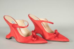 A PAIR OF PRADA RED SILK SHOES, UNUSED, appear as new in box. Size UK 36.5.