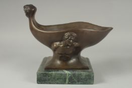 A BRONZE ABSTRACT OVAL BOWL on a marble base.